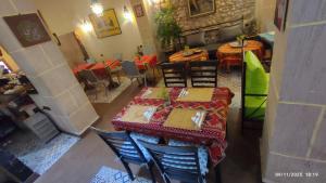 an overhead view of a restaurant with tables and chairs at Riad Bladi Essaouira in Essaouira +37 photos