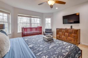 a bedroom with a bed and a dresser and a tv at Hot Tub and Lake Access Spacious Tobyhanna Home in Tobyhanna +37 photos