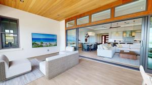 an open living room with white furniture and glass walls at ❤PiH❤ Hale Moana Heated Private Pool Spa Detached Ohana Suite in Waimea