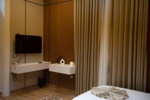 a hotel room with a sink and a mirror at El Tahrir View Hotel in Cairo