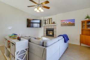 a living room with a couch and a fireplace at Family Home, 7 Mi to Joshua Tree National Park! in Twentynine Palms