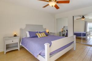 a bedroom with a bed and a ceiling fan at Family Home, 7 Mi to Joshua Tree National Park! in Twentynine Palms