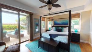 a bedroom with a bed and a large mirror at HOUSE OF JOY Light and Airy 4BR KaMilo Home with Heated Pool and Spa in Waikoloa +52 photos