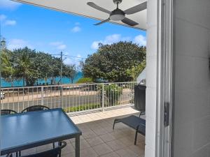a patio with a blue table and a view of the ocean at Arcadia Beach Unit 4 in Arcadia