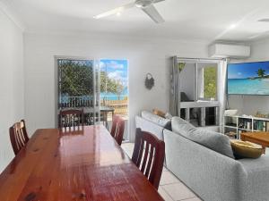 a dining room with a table and a couch at Arcadia Beach Unit 4 in Arcadia