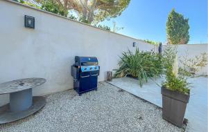 a blue stove sitting next to a wall at Nice Home In Cabannes in Cabannes