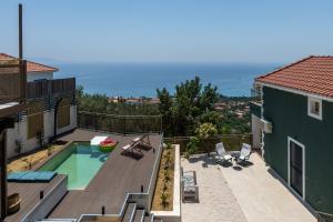 an aerial view of a house with a swimming pool at Trithea Villa in Vlachata