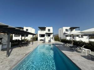 a swimming pool in front of a villa at Villa Finoe 4 BDR with Private Pool in Plaka