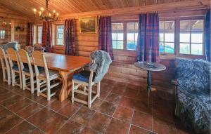 a dining room with a wooden table and chairs at 4 Bedroom Gorgeous Home In Rjukan in Gaustablikk