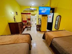 Giường trong phòng chung tại Hotel Magic Collinn