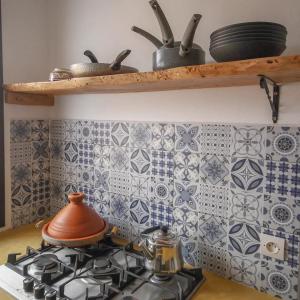 Η κουζίνα ή μικρή κουζίνα στο Appartement Madeleine Uniquement les familles