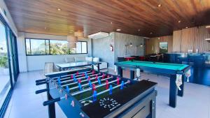 a room with two ping pong tables in it at Maré Alta Beach Hall - Praia de Tamandaré in Praia dos Carneiros