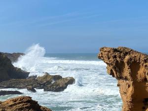 a view of the ocean from a cliff at Appartement Michel Uniquement les familles in Oualidia
