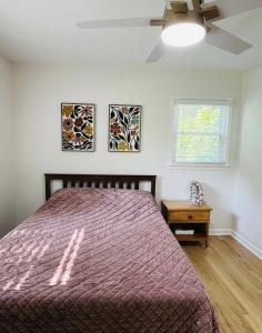 a bedroom with a bed and a window at The Marietta Haus in Marietta
