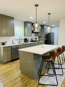 a kitchen with a large island in the middle at The Marietta Haus in Marietta