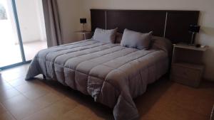 Postel nebo postele na pokoji v ubytování Altos del TALAMPAYA + 19 fotografií