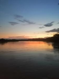 a sunset over a body of water at Casa Zona Rosa in La Dorada
