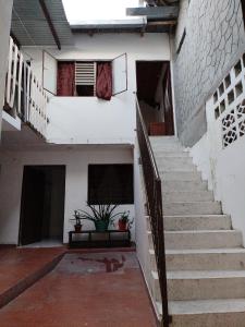 a staircase in a building with a potted plant at Casa Zona Rosa in La Dorada