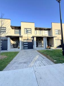 a large house with a driveway in front of it at Charming Stay in London in London