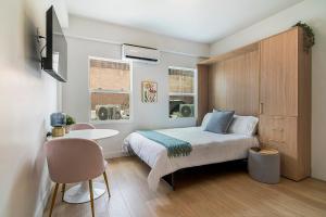 Postel nebo postele na pokoji v ubytování The Arts