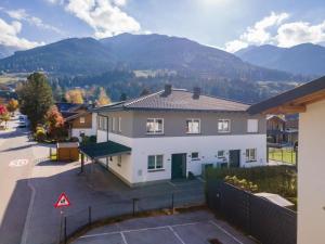 an aerial view of a house with mountains in the background at JooP in Niedernsill