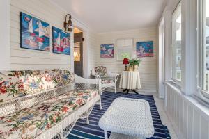 a living room with a couch and a table at Kennebunk Cottage with Yard Less Than 1 Mi to Beach! in Kennebunk