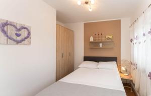 Postel nebo postele na pokoji v ubytování Apartments with parking space Povljana, Pag - 232