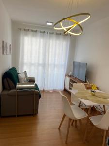 a living room with a couch and a table at AP Iilha de Aruba Prox a Avenida Litoranea in São Luís