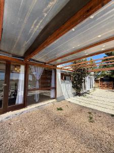 an outside view of a house with a large window at Casa en playas del sur de mar del plata, la musa beach and home in San Eduardo del Mar