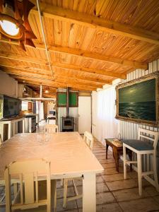 a dining room with a table and some chairs at Casa en playas del sur de mar del plata, la musa beach and home in San Eduardo del Mar