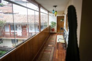 a balcony of a house with a view of a building at Hermoso Apartamento in Cusco