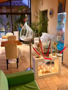 a living room with a couch and some plants at La Siègià Resort spa in Massa Marittima +120 photos