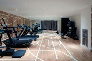 a gym with a row of treadmills and exercise equipment at citizenM Boston North Station in Boston