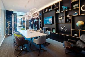a dining room with a table and chairs at citizenM Boston North Station in Boston