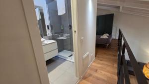 a bathroom with a sink and a mirror at BG Suite in Bergamo