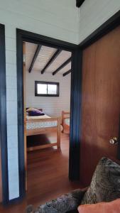 Postel nebo postele na pokoji v ubytování Departamento vista al lago + 1 fotografie