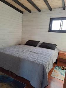 Postel nebo postele na pokoji v ubytování Departamento vista al lago