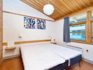 a bedroom with a bed in a room with a window at 6 person holiday home in Gilleleje in Gilleleje