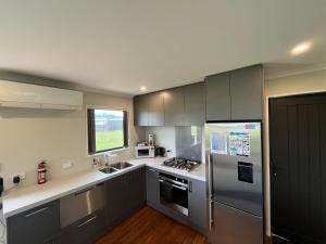 Η κουζίνα ή μικρή κουζίνα στο Twizel - Apartment on Woodley