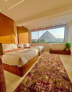 Ένα ή περισσότερα κρεβάτια σε δωμάτιο στο New Joia Pyramids Hotel +106 φωτογραφίες