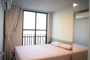 a bedroom with a bed and a large window at Oásis Vistamar in Luis Correia +54 photos