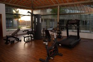 a gym with several exercise bikes in a room at Oásis Vistamar in Luis Correia