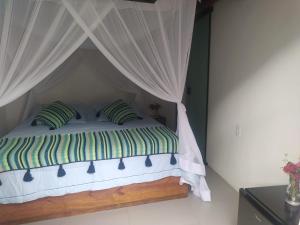 Postel nebo postele na pokoji v ubytování SuÍte MAR Espaço Kombucha Para-ty