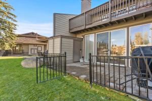 a house with a fence in front of a yard at TKC0693- Keys Dream townhouse in South Lake Tahoe