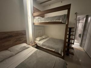 Ένα ή περισσότερα κρεβάτια σε δωμάτιο στο CIELITO LINDO