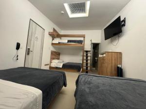 Ένα ή περισσότερα κρεβάτια σε δωμάτιο στο CIELITO LINDO