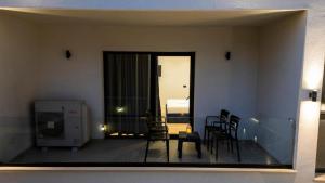 a view of a living room with a table and chairs at Vila Claus Hotel in Tirana