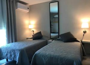 Ένα ή περισσότερα κρεβάτια σε δωμάτιο στο Nash Guesthouse