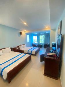 Ένα ή περισσότερα κρεβάτια σε δωμάτιο στο Khu Nghỉ Dưỡng Đoàn 298 Khu 7 Tầng +74 φωτογραφίες