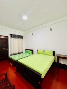 Postel nebo postele na pokoji v ubytování Jasmine Garden & Resort